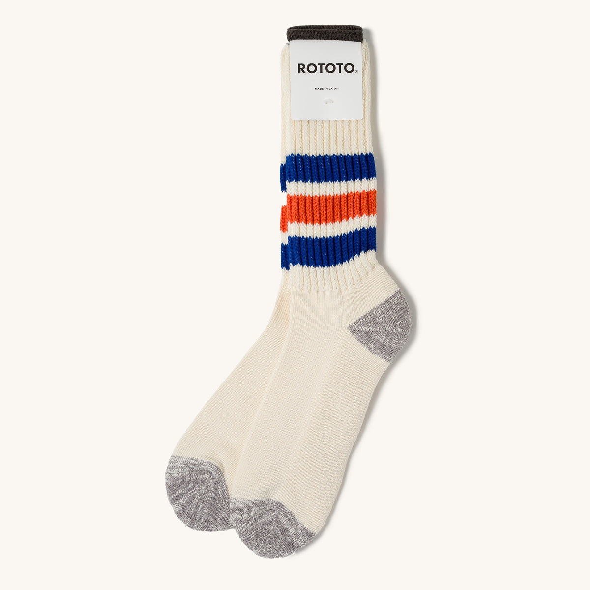 Cream ribbed crew socks by Rototo with blue and orange stripes, grey heel/toe, and dark cuff.