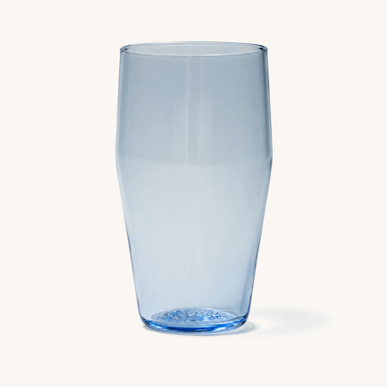 Clear standard pint glass with blue-tinted base and textured bottom, shown front view on white background