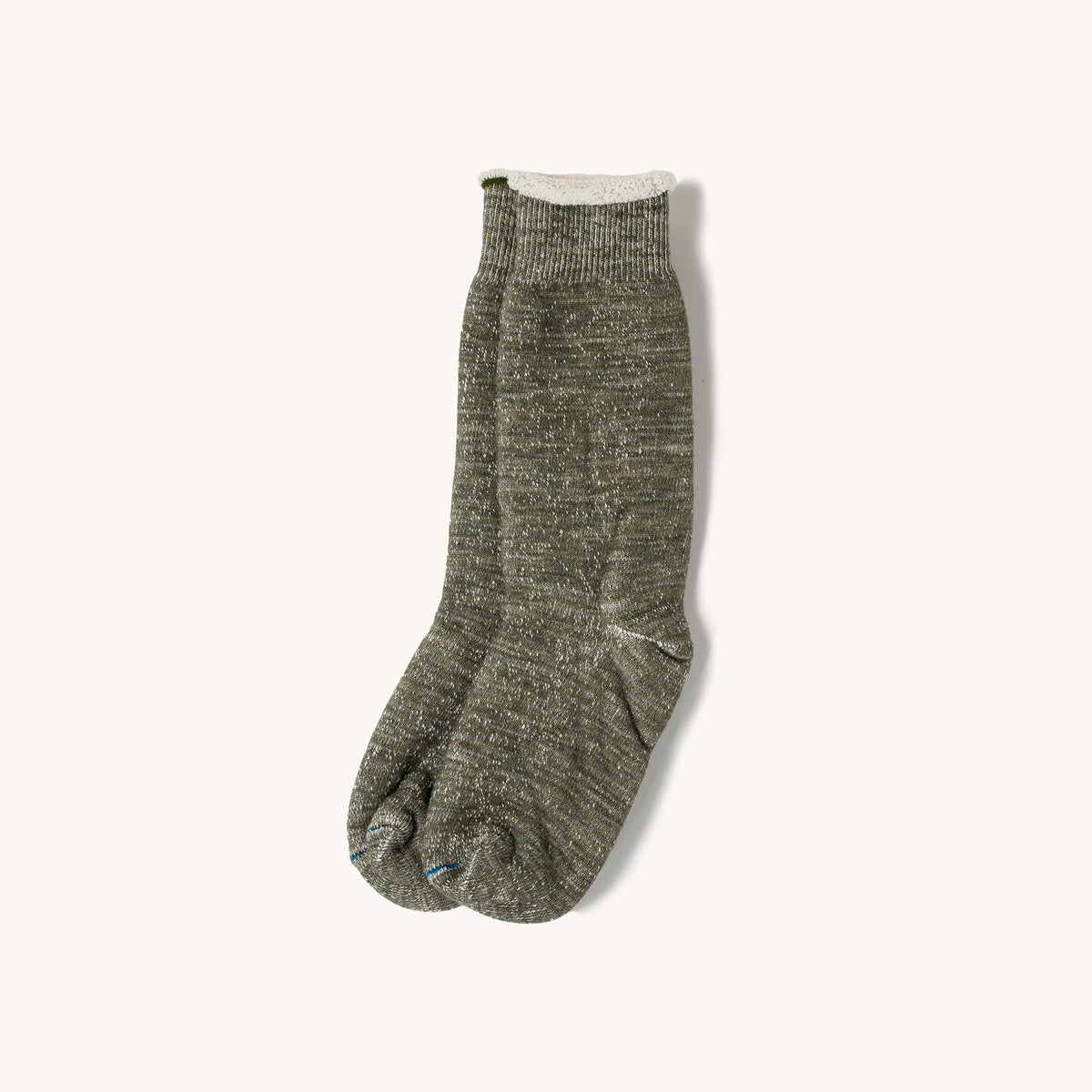 Army green double face tabi crew socks with ribbed cuff and split toe, shown flat on cream background.
