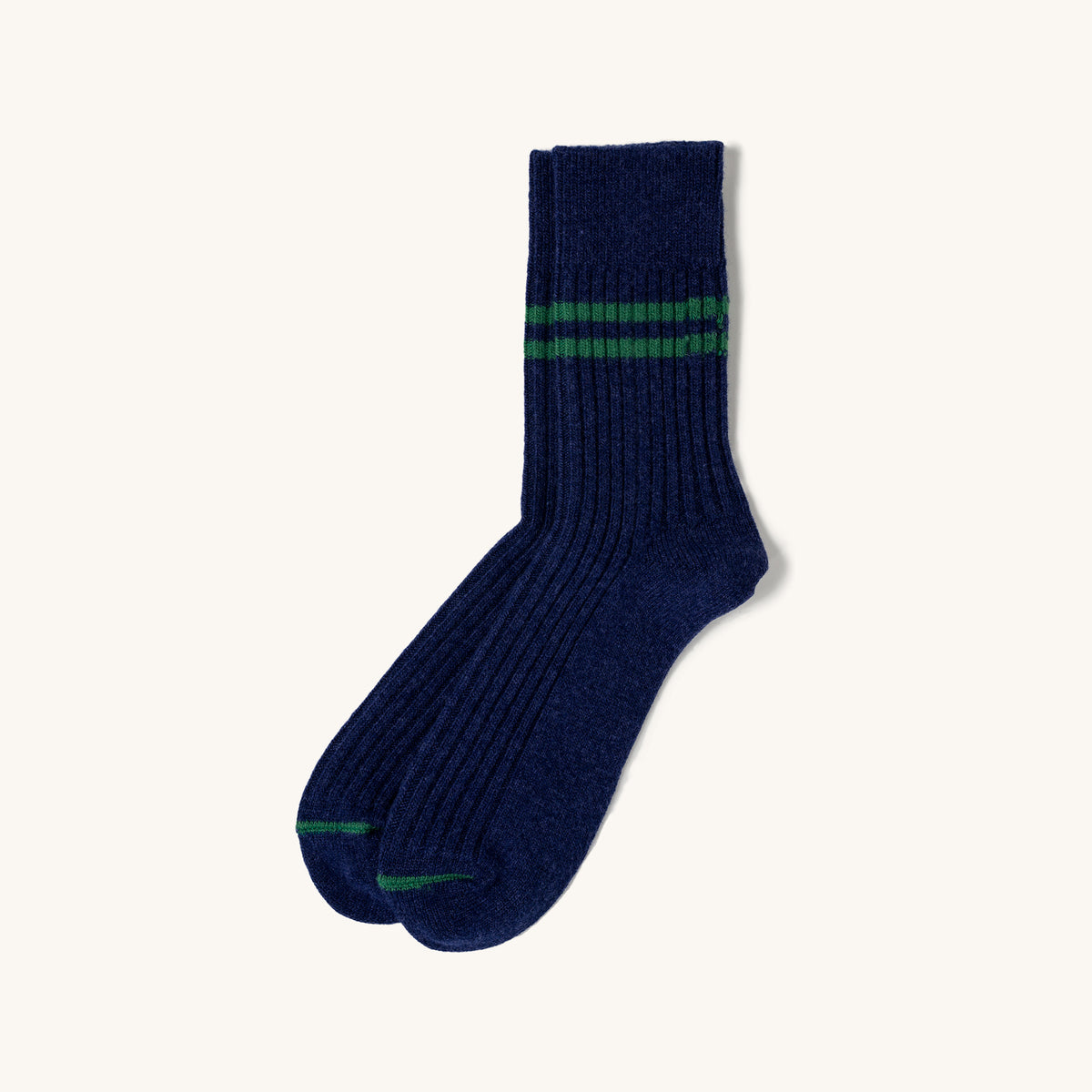 Navy ribbed merino lambswool socks with green stripes at the cuff and toe, shown in a side view.