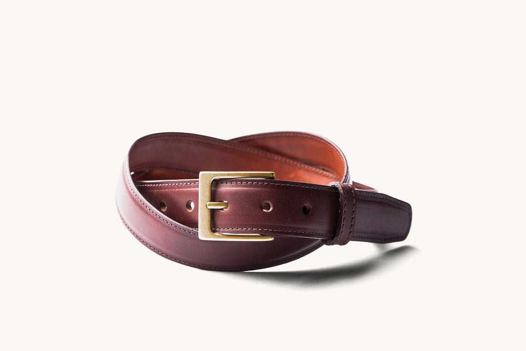brown leather belt with brass buckle